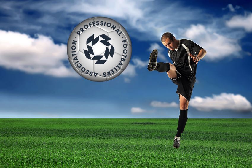 Young footballer kicking ball with PFA logo