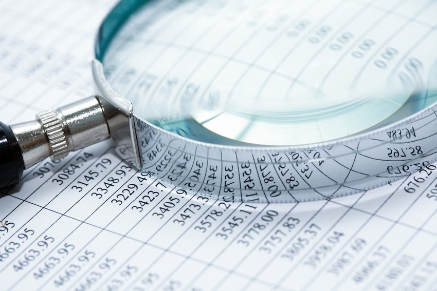 Magnifying Glass Close Up on Balance Sheet